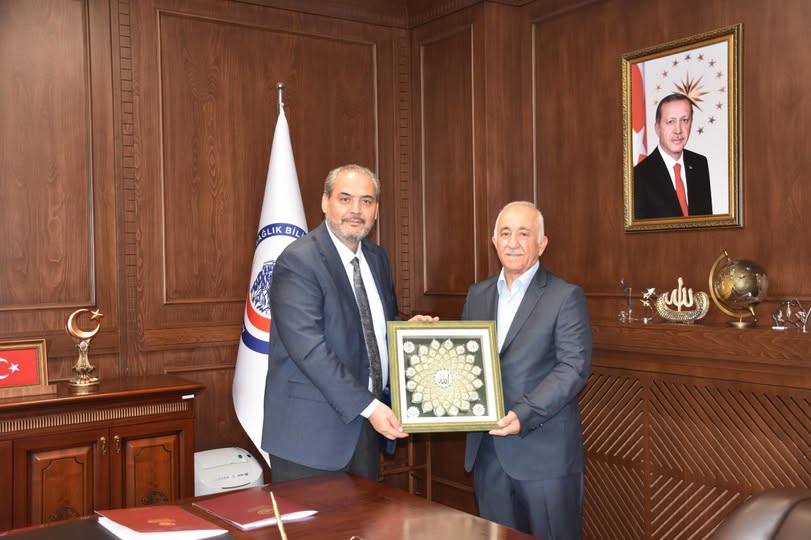 AFSÜ Rektörü Aslan, Emekli Genel Sekreter Yardımcısı Aydoğan'ı Kabul Etti